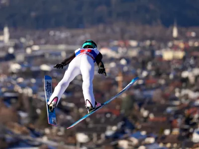 Nika Prevc, of Slovenia, soars through the air during her first round jump at the women's ski jumping World Cup competition in Garmisch-Partenkirchen, Germany, Wednesday, Dec. 31, 2025. (AP Photo/Matthias Schrader)