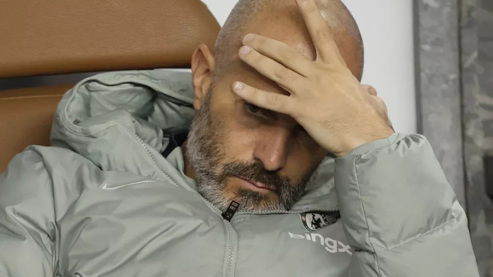 FILE - Chelsea's head coach Enzo Maresca sits on a bench ahead of the Champions League opening phase soccer match between Qarabag and Chelsea in Baku, Azerbaijan, on Nov. 5, 2025. (AP Photo, File)