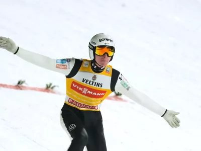 Domen Prevc, of Slovenia, lands his qualification jump at the second stage of the Four Hills ski jumping tournament in Garmisch-Partenkirchen, Germany, Wednesday, Dec. 31, 2025. (AP Photo/Matthias Schrader)