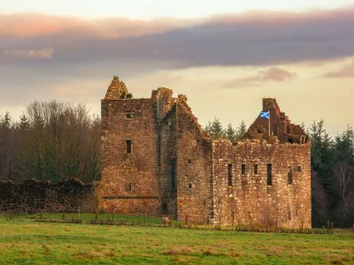 Torwood Castle on an autumnal day. With the saltire flag flying.,Image: 1056640388, License: Rights-managed, Restrictions:, Model Release: no