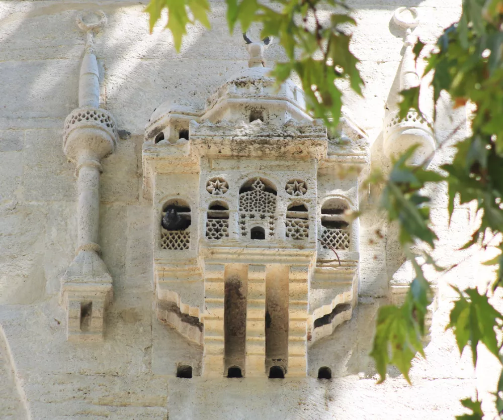 These kinds bird houses are called by bird palaces for pigeons and city birds. This is on the Yeni Valide Mosque`s exterior wall in Uskudar, Istanbul, Turkey.