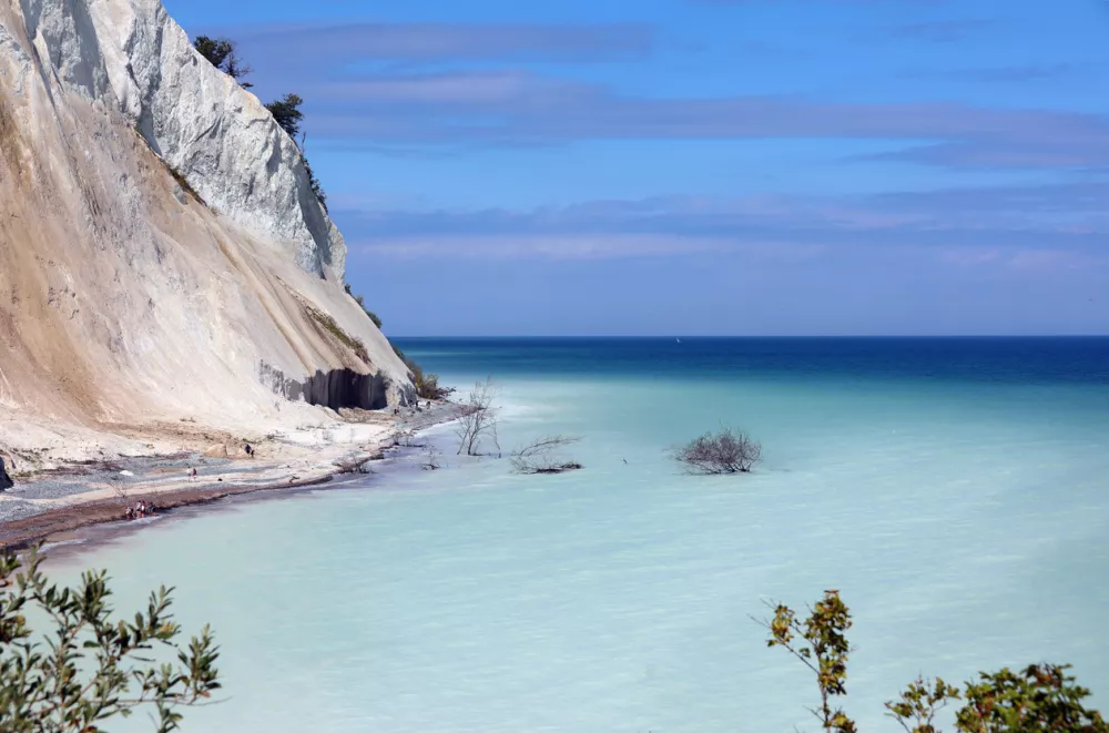 fabulous clear blue sea and the white cliff sloping down to the coast and the blue sky