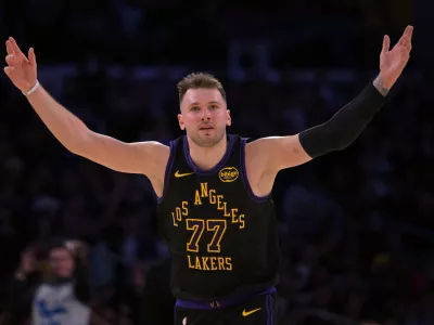 Jan 2, 2026; Los Angeles, California, USA; Los Angeles Lakers guard Luka Doncic (77) reacts after a 3-point basket in the second half against the Memphis Grizzlies at Crypto.com Arena. Mandatory Credit: Jayne Kamin-Oncea-Imagn Images