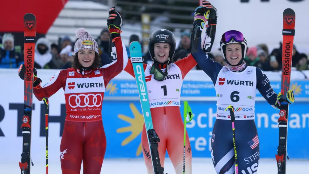 Alpine Skiing - FIS Alpine Ski World Cup - Women's Giant Slalom - Kranjska Gora, Slovenia - January 3, 2026 Switzerland's Camille Rast celebrates winning the women's giant slalom with second placed Austria's Julia Scheib and third placed Paula Moltzan of the U.S. REUTERS/Borut Zivulovic