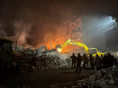 Rescuers work at the site of an apartment building hit by a Russian air strike, amid Russia's attack on Ukraine, in Kharkiv, Ukraine January 2, 2026. REUTERS/Sofia Gatilova