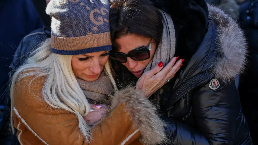 Laetitia Brodard-Sitre the mother of Arthur Bodard, who died during the deadly fire and explosion at a New Year's Eve party in "Le Constellation" bar, mourns at a makeshift memorial outside the bar, in the upscale ski resort of Crans-Montana in southwestern Switzerland, January 4, 2026. REUTERS/Umit Bektas