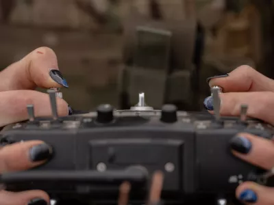 Monka, a Ukrainian FPV drone operator from the third assault brigade, pilots an FPV drone during a demonstration for The Associated Press, Wednesday, Nov. 5, 2025, in Kharkiv Oblast, Ukraine. (AP Photo/Julia Demaree Nikhinson)