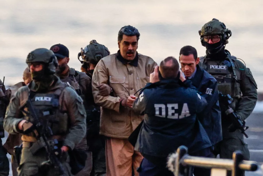 Captured Venezuelan President Nicolas Maduro arrives at the Downtown Manhattan Heliport, as he heads towards the Daniel Patrick Manhattan United States Courthouse for an initial appearance to face U.S. federal charges including narco-terrorism, conspiracy, drug trafficking, money laundering and others in New York City, U.S., January 5, 2026. REUTERS/Eduardo Munoz