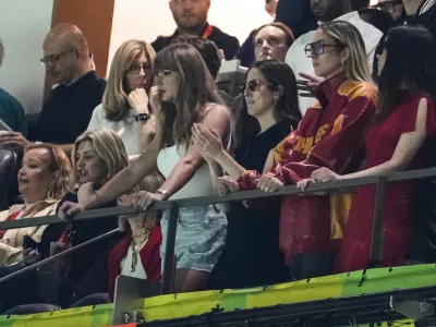 Taylor Swift, from left, Alana Haim, Este Haim and Danielle Haim watches action during the first half of the NFL Super Bowl 59 football game between the Kansas City Chiefs and the Philadelphia Eagles, Sunday, Feb. 9, 2025, in New Orleans. (AP Photo/Gerald Herbert)