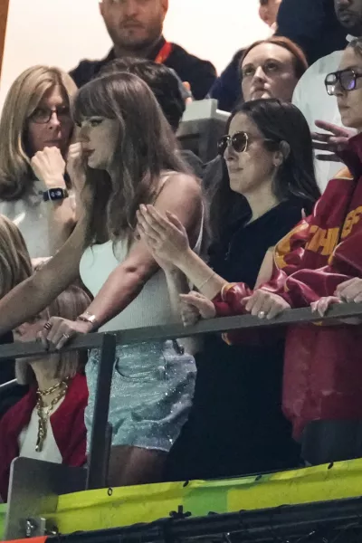 Taylor Swift, from left, Alana Haim, Este Haim and Danielle Haim watches action during the first half of the NFL Super Bowl 59 football game between the Kansas City Chiefs and the Philadelphia Eagles, Sunday, Feb. 9, 2025, in New Orleans. (AP Photo/Gerald Herbert)