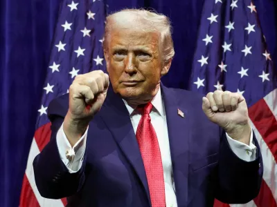 FILE PHOTO: U.S. President Donald Trump gestures as he addresses House Republicans at their annual issues conference retreat, at the Kennedy Center, renamed the Trump-Kennedy Center by the Trump-appointed board of directors, in Washington, D.C., U.S., January 6, 2026. REUTERS/Kevin Lamarque/File Photo
