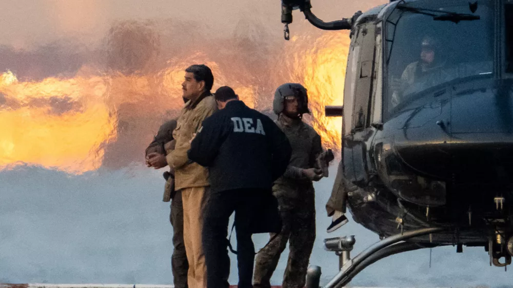 Captured Venezuelan President Nicolas Maduro is escorted, as he heads towards the Daniel Patrick Moynihan United States Courthouse in Manhattan for an initial appearance to face U.S. federal charges including narco-terrorism, conspiracy, drug trafficking, money laundering and others at Downtown Manhattan Heliport, in New York City, U.S., January 5, 2026. REUTERS/Adam Gray