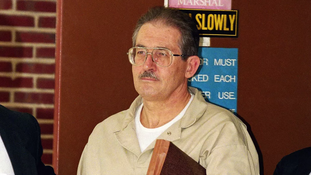 FILE - Former CIA agent Aldrich Ames leaves federal court after pleading guilty to espionage and tax evasion conspiracy charges April 28, 1994, in Alexandria, Va. (AP Photo/Wilfredo Lee, File)
