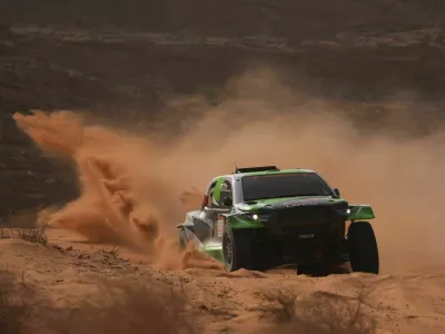 Driver Eryk Goczal and co-driver Szymon Gospodarczyk compete during the third stage of the Dakar Rally with a start and finish in Alula, Saudi Arabia, Tuesday, Jan. 6, 2026. (AP Photo/Thibault Camus)