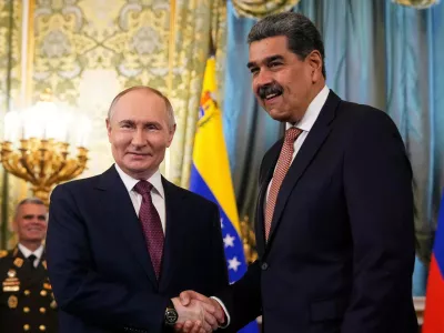 FILE - Russian President Vladimir Putin, left, shakes hands with Venezuelan President Nicolas Maduro during their meeting at the Kremlin in Moscow, Russia, Wednesday, May 7, 2025, ahead of celebrations of the 80th anniversary of the Soviet Union's victory over Nazi Germany during the World War II. (AP Photo/Alexander Zemlianichenko, file)