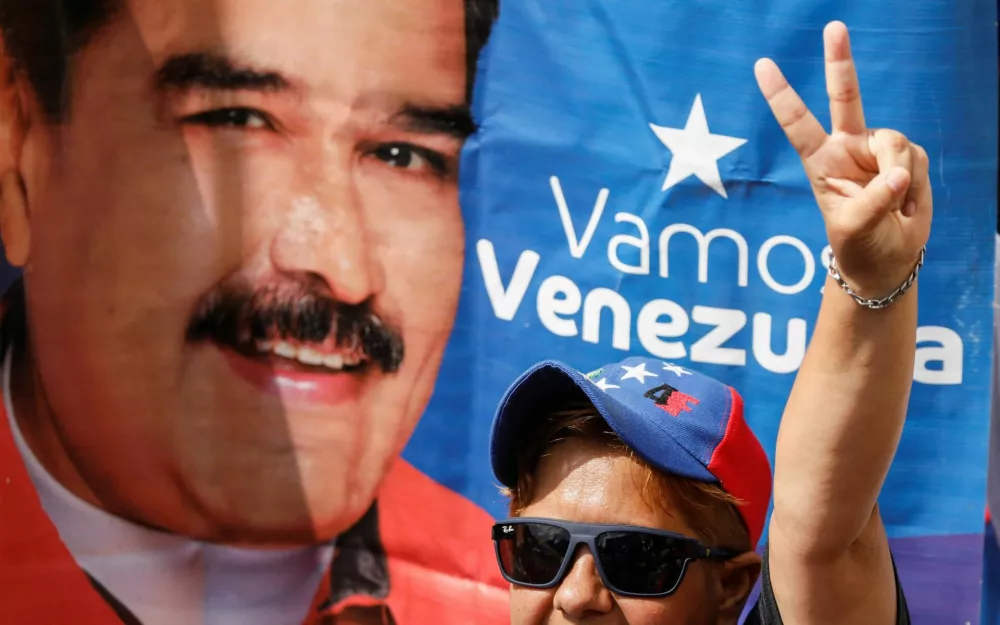 A government supporter gestures as he participates in a march calling for the release of Venezuela's ousted President Nicolas Maduro and his wife, Cilia Flores, after they were captured in a U.S. operation in the capital on January 3, in Caracas, Venezuela, January 7, 2026. REUTERS/Fausto Torrealba