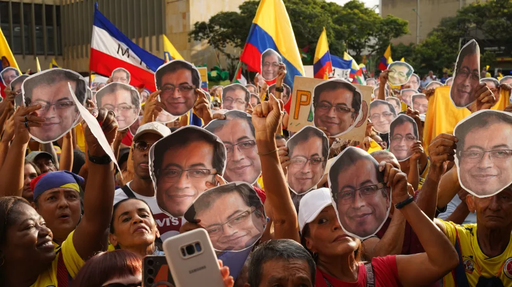 07 January 2026, Colombia, Cali: Demonstrators hold cutout faces of president Gustavo Petro as the Colombian President speaks during a rally in defence of national sovereignty in Cali, after US President Donald Trump suggested the United States might intervene militarily in Colombia, days after US forces struck Venezuela and captured Venezuelan President Nicolas Maduro and his wife Cilia Flores. Photo: Sebastian Marmolejo/LongVisual via ZUMA Press Wire/dpa