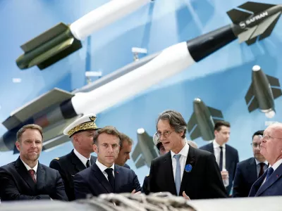 FILE PHOTO: French President Emmanuel Macron listens to CEO of Safran Olivier Andries as French Minister for Industry and Energy Marc Ferracci, and Ross McInnes, Chairman of the Board of Safran, look on at the stand of aerospace and defence company Safran during a visit at the 55th International Paris Airshow at Le Bourget Airport near Paris, France, June 20, 2025. REUTERS/Benoit Tessier/Pool/File Photo