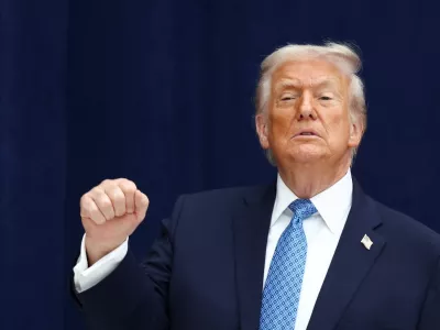 U.S. President Donald Trump gestures during a signing ceremony with President of the Democratic Republic of the Congo Felix Tshisekedi and President of Rwanda Paul Kagame at the U.S. Institute of Peace in Washington, D.C., U.S., December 4, 2025. REUTERS/Kevin Lamarque