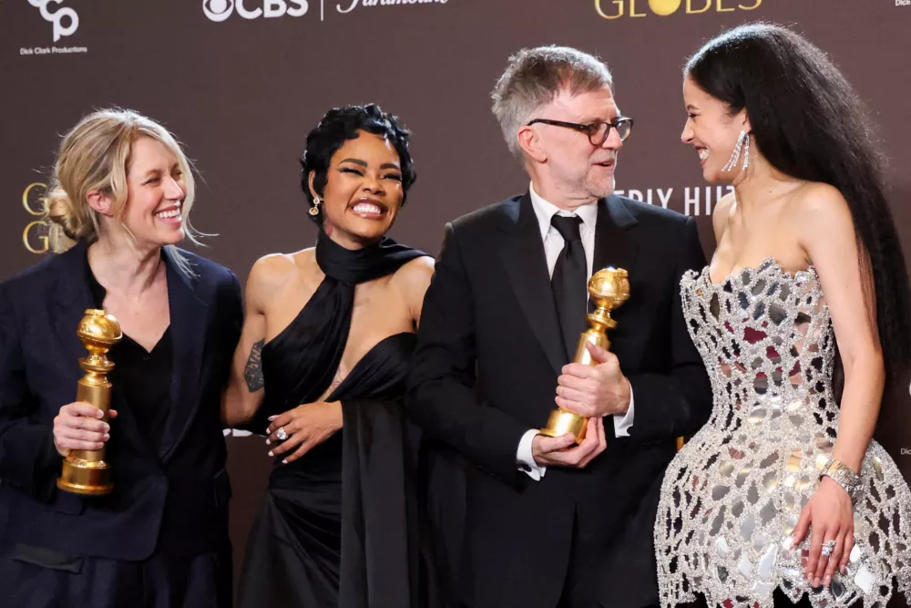 Sara Murphy, Teyana Taylor, Paul Thomas Anderson and Chase Infiniti pose with the Best Motion Picture - Musical or Comedy award for "One Battle After Another" at the 83rd Annual Golden Globes in Beverly Hills, California, U.S., January 11, 2026. REUTERS/Mario Anzuoni   TPX IMAGES OF THE DAY