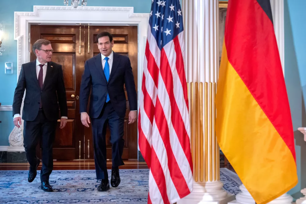 Secretary of State Marco Rubio, right, walks with Germany's Foreign Minister Johann Wadephul at the State Department, Monday, Jan. 12, 2026, in Washington. (AP Photo/Mark Schiefelbein).