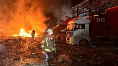 Firefighters work at the site of a logistics hub of a private delivery company hit by Russian missile strikes, amid Russia's attack on Ukraine, in Kharkiv, Ukraine January 13, 2026. REUTERS/Vitalii Hnidyi