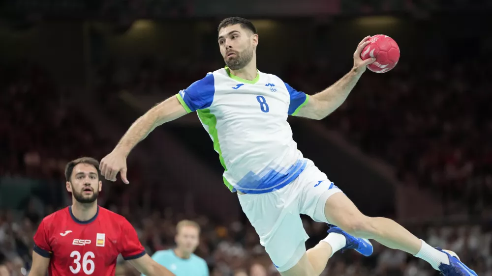 Slovenia's Blaz Janc is in action during the bronze medal handball match between Spain and Slovenia at the 2024 Summer Olympics, Sunday, Aug. 11, 2024, in Villeneuve-d'Ascq, France. (AP Photo/Brian Inganga)