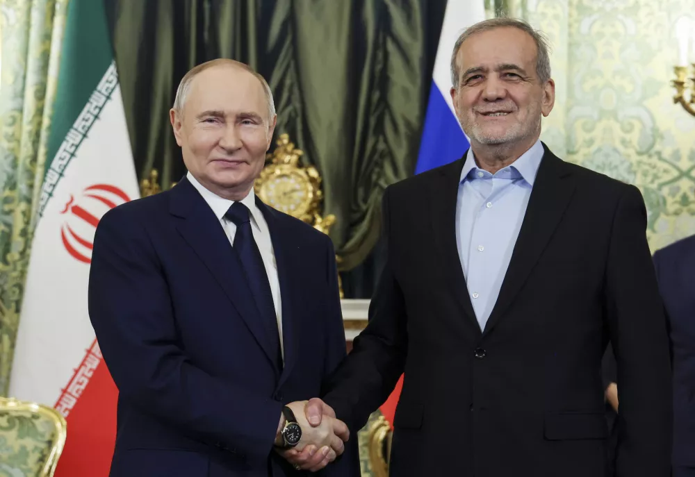 FILE - Russian President Vladimir Putin, left, and Iranian President Masoud Pezeshkian pose for a photo during their meeting at the Kremlin in Moscow, Russia, on Jan. 17, 2025. (Vyacheslav Prokofyev, Sputnik, Kremlin Pool Photo via AP, File)