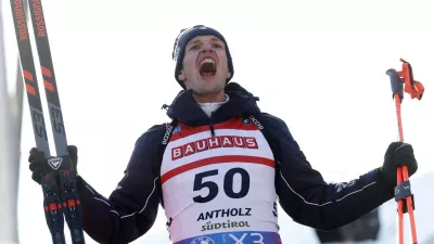 Third placed Tommaso Giacomel of Italy celebrates after a Biathlon men's World Cup 10km sprint race, in Anterselva, Italy, Friday Jan. 24, 2025. (AP Photo/Alessandro Trovati)