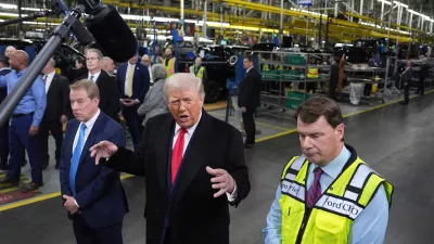 President Donald Trump speaks as Bill Ford, Executive Chairman of Ford, left, and Jim Farley, CEO of Ford, listen during a tour of the Ford River Rogue complex, Tuesday, Jan. 13, 2026, in Dearborn, Mich. (AP Photo/Evan Vucci)