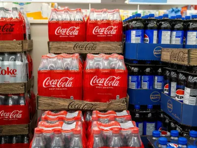 FILE PHOTO: Cases of soft drinks, including Coca-Cola and Pepsi, are stacked for sale at a grocery store in Hamilton, Ontario, Canada, January 28, 2025. REUTERS/Carlos Osorio/File Photo