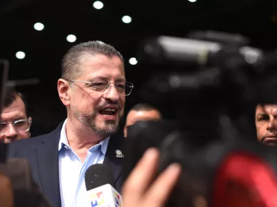 Costa Rican President Rodrigo Chaves speaks during a news conference regarding the seizure of four tons of drugs, at an air base in San Jose, Costa Rica, Friday, Nov. 28, 2025. (AP Photo/Jose Diaz)