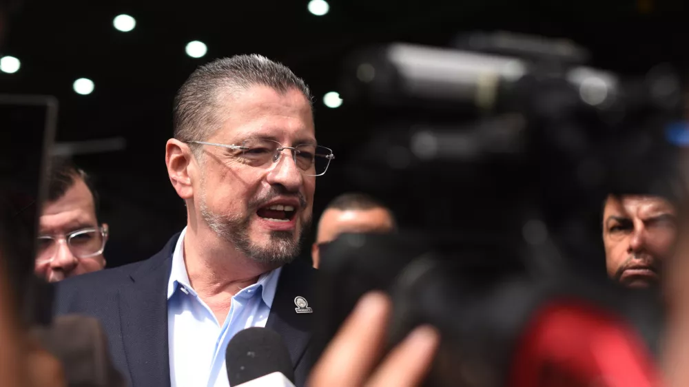 Costa Rican President Rodrigo Chaves speaks during a news conference regarding the seizure of four tons of drugs, at an air base in San Jose, Costa Rica, Friday, Nov. 28, 2025. (AP Photo/Jose Diaz)