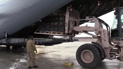 Ukrainian service members unload anti-tank weapons supplied by Britain at the Boryspil airport outside Kyiv, Ukraine January 18, 2022. Picture taken January 18, 2022. Ukrainian Defence Ministry/Handout via REUTERS ATTENTION EDITORS - THIS IMAGE WAS PROVIDED BY A THIRD PARTY.