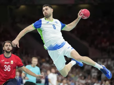Slovenia's Blaz Janc is in action during the bronze medal handball match between Spain and Slovenia at the 2024 Summer Olympics, Sunday, Aug. 11, 2024, in Villeneuve-d'Ascq, France. (AP Photo/Brian Inganga)