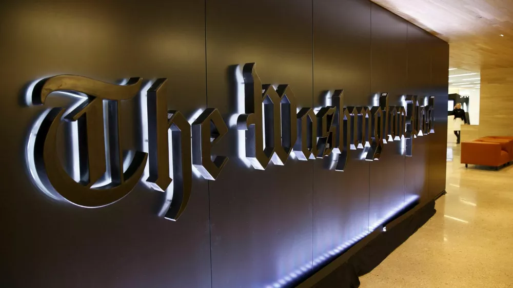 FILE PHOTO: The newspaper's banner logo is seen during the grand opening of the Washington Post newsroom in Washington January 28, 2016. REUTERS/Gary Cameron/File Photo