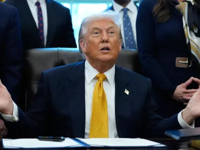 President Donald Trump speaks in the Oval Office of the White House, Wednesday, Jan. 14, 2026, in Washington, before signing a bill that returns whole milk to school cafeterias across the country.. (AP Photo/Alex Brandon)