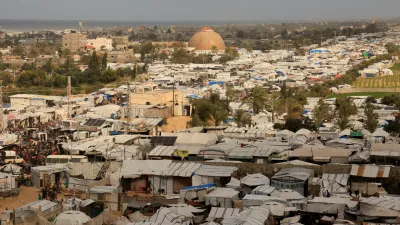 Displaced Palestinians shelter at a tent camp in Khan Younis, southern Gaza Strip, January 14, 2026. REUTERS/Haseeb Alwazeer