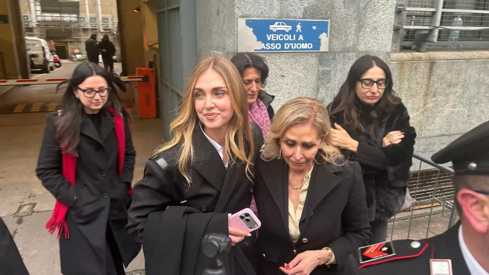 Influencer Chiara Ferragni, with her mother Marina Di Guardo, right, leaves the Milan Law Court on Wednesday, Jan. 14, 2026, after a first-instance acquittal in a trial in which she was indicted for promoting misleading advertising presented as charity. (AP Photo/Antonio Calanni)