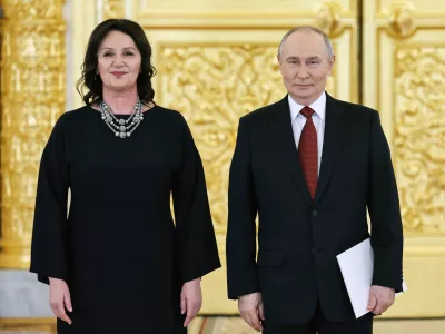 Russian President Vladimir Putin, right, and Slovenian Ambassador to Russia, Alenka Suhadolnik, attend a ceremony to receive credentials from newly arrived ambassadors at the Alexander Hall of the Grand Kremlin Palace in Moscow, Russia, Thursday, Jan. 15, 2026. (Alexander Kazakov, Sputnik, Kremlin Pool Photo via AP)
