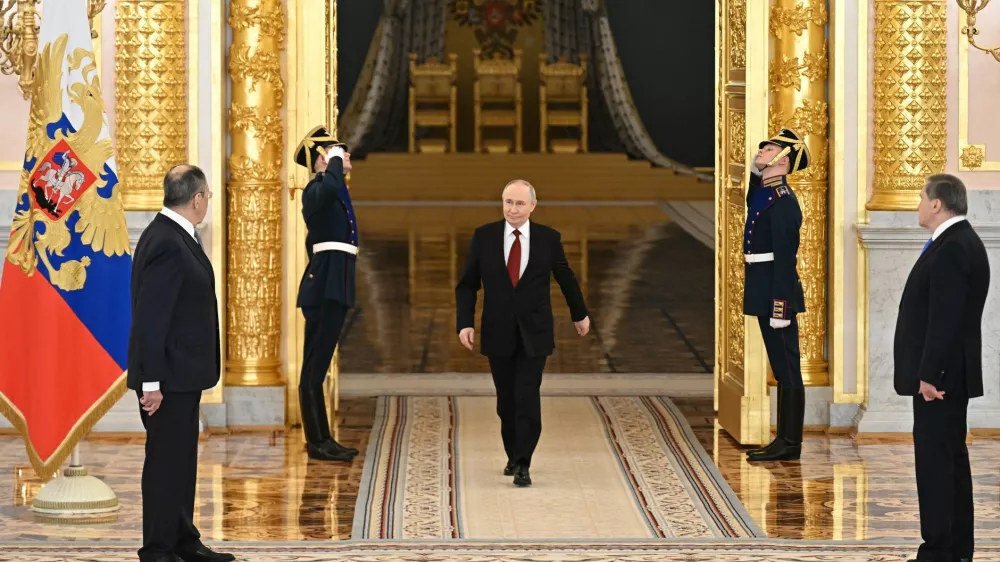 HANDOUT - 15 January 2026, Russia, Moscow: Russian President Vladimir Putin arrives to the ceremony to receive the credentials of newly appointed Ambassadors to Russia. Photo: Sergey Bobylev/Kremlin/dpa - ATTENTION: editorial use only and only if the credit mentioned above is referenced in full