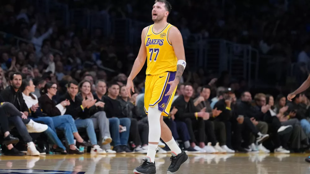 Jan 15, 2026; Los Angeles, California, USA; Los Angeles Lakers guard Luka Doncic (77) reacts against the Charlotte Hornets in the second half at Crypto.com Arena. Mandatory Credit: Kirby Lee-Imagn Images