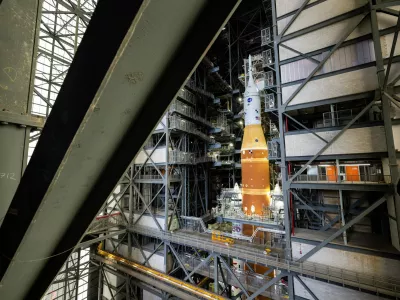 NASA's Artemis II SLS (Space Launch System) rocket and Orion spacecraft, secured to the mobile launcher, is seen inside the Vehicle Assembly building as preparations continue for roll out to Launch Pad 39B, Thursday, Jan. 15, 2026, at NASA's Kennedy Space Center in Florida. (Keegan Barber/NASA via AP)