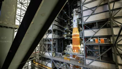 NASA's Artemis II SLS (Space Launch System) rocket and Orion spacecraft, secured to the mobile launcher, is seen inside the Vehicle Assembly building as preparations continue for roll out to Launch Pad 39B, Thursday, Jan. 15, 2026, at NASA's Kennedy Space Center in Florida. (Keegan Barber/NASA via AP)