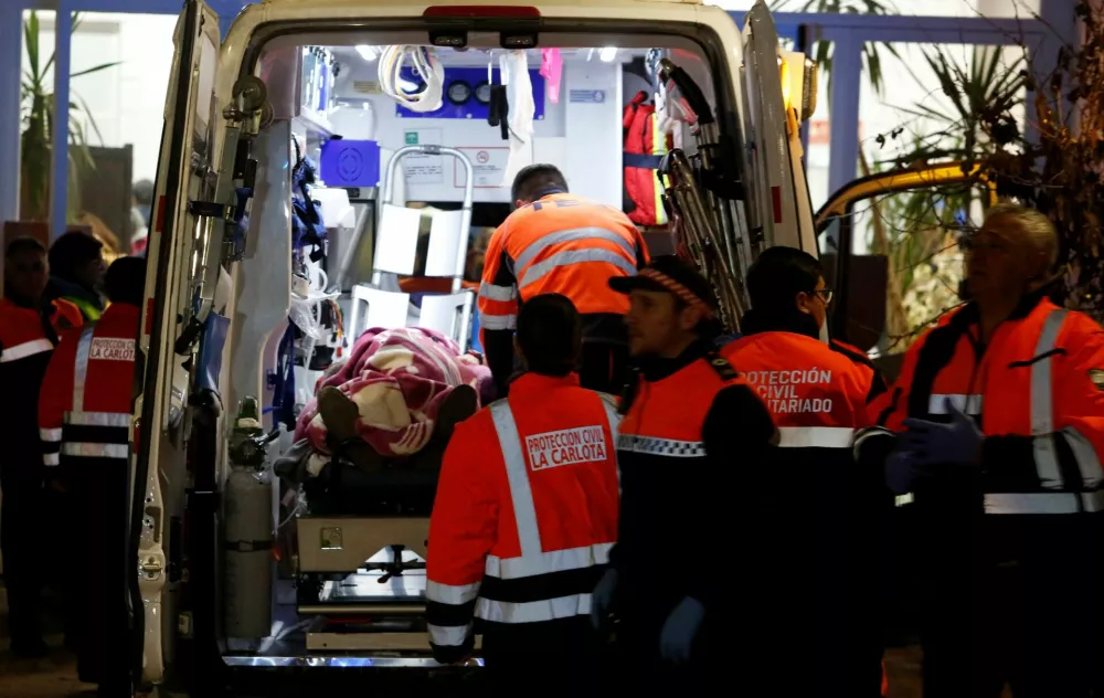 People affected by a deadly train derailment are transferred and treated at the Caseta Municipal in the town of Adamuz, after a high-speed train derailed and collided with another approaching train near Cordoba, Spain, January 18, 2026. REUTERS/Alex Gallegos