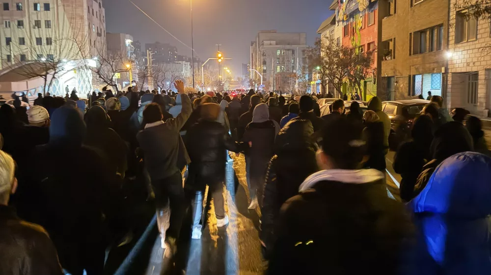 In this photo obtained by The Associated Press, Iranians attend an anti-government protest in Tehran, Iran, Thursday, Jan. 8, 2026. (UGC via AP)