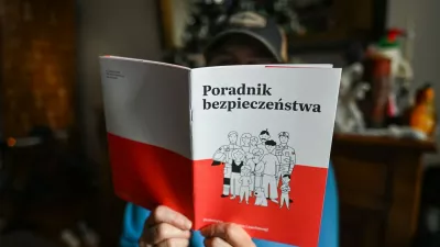 KRAKOW, POLAND - JANUARY 18:A person reads a copy of the Security Guide (Polish: Poradnik Bezpieczenstwa), distributed to households nationwide by the Polish government, in Krakow, Poland, on January 18, 2026.The guide aims to help residents prepare for crisis situations such as natural disasters, infrastructure failures, cyber threats and potential military scenarios, with 16.8 million copies scheduled for delivery by the end of January.Security Guide Delivered To Households Across Poland, Krakow - 18 Jan 2026,Image: 1067214354, License: Rights-managed, Restrictions:, Model Release: no