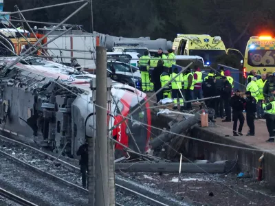 Members of the Spanish Civil Guard, along with other emergency personnel, work next to one of the trains&nbsp;involved in the accident, at the site of a deadly derailment of two high-speed trains near Adamuz, in Cordoba, Spain, January 19, 2026. REUTERS/Susana Vera