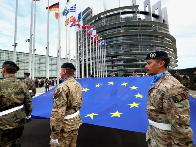 Eurocorps soldiers carry a European Union flag during the flag-raising ceremony on the eve of the inaugural session of new European Parliament in front of Louise Weiss building, headquarters of the European Parliament in Strasbourg, eastern France, on July 15, 2024.,Image: 889869139, License: Rights-managed, Restrictions:, Model Release: no