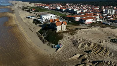 This aerial picture shows a mechanical excavator using sand brought by trucks from the northern dune cord outside the city, to reinforce the dune beside twin early 20th century villas (C) and a hotel, threatened by marine erosion, in Biscarosse southwestern France on January 17, 2025.,Image: 955698814, License: Rights-managed, Restrictions:, Model Release: no